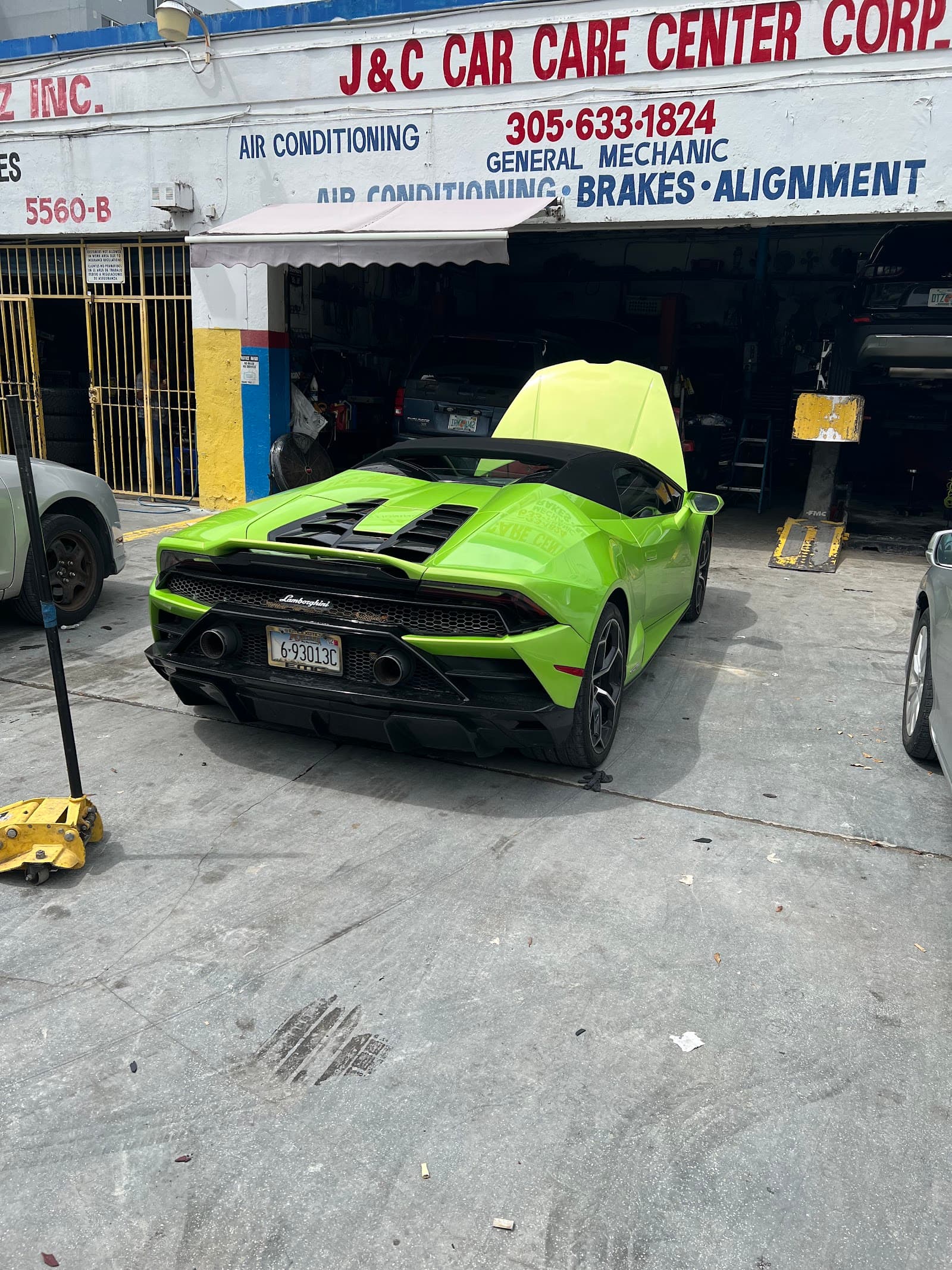 A vehicle inside the J C Car Care Center shop